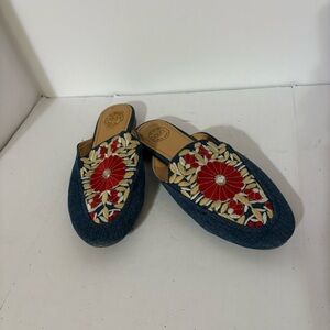 Dolce by Mojo Moxy slide mules with embroidered floral details.